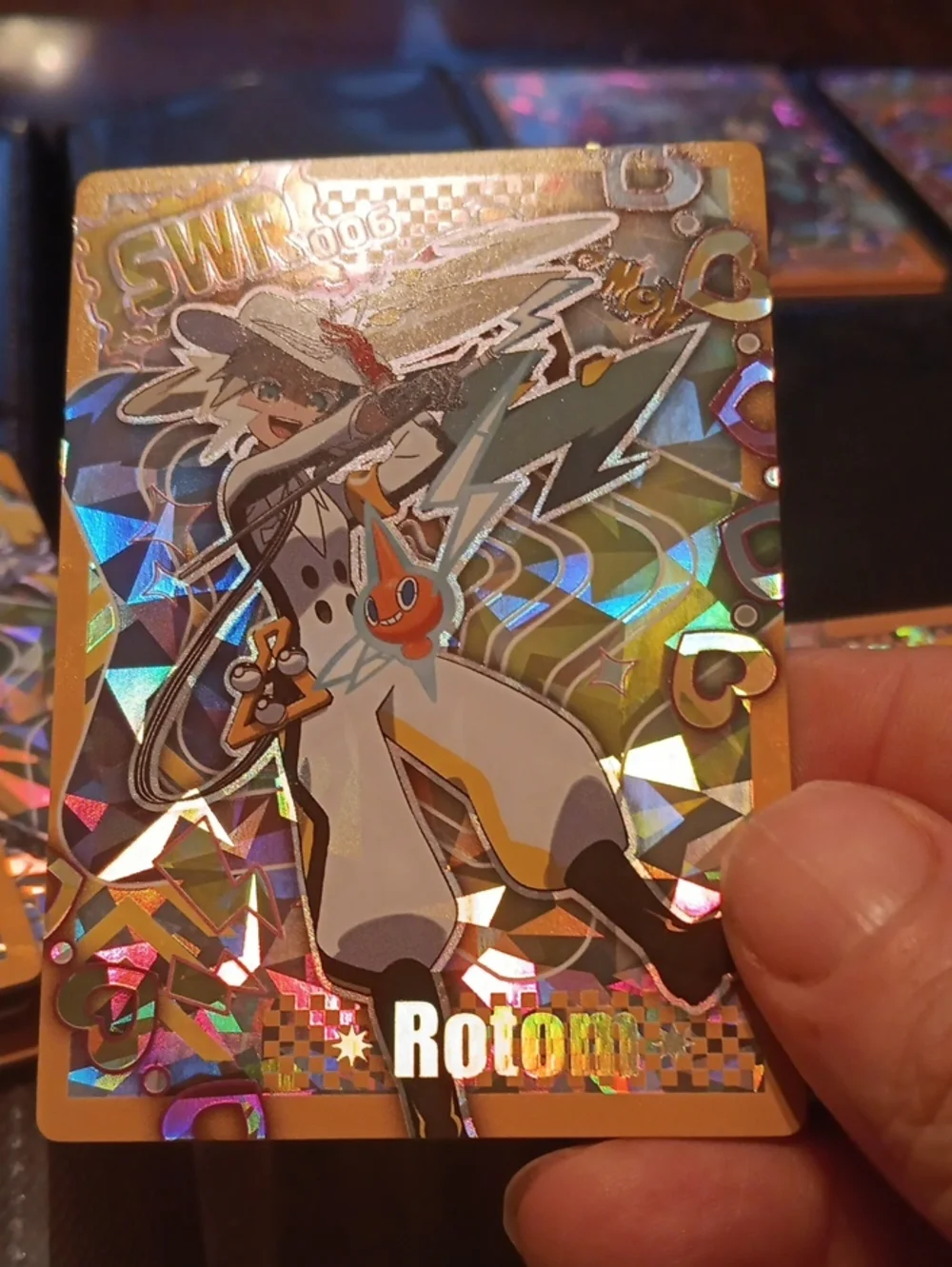 Pokemon Gold Holographic Rotom Card with White, Yellow, Black Accents